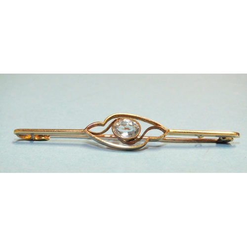 330 - An Edwardian 15ct gold bar brooch set an oval aquamarine, length 56mm, 3.1g.