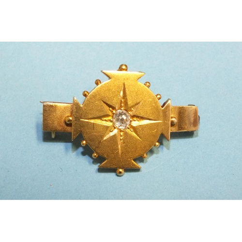 332 - A Victorian brooch centrally-set an old brilliant-cut diamond, in incised star setting, 29 x 20mm, 3... 