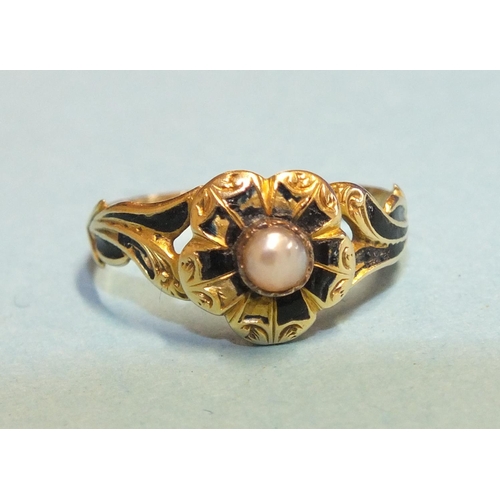 337 - A Victorian mourning ring, the black-enamelled and pearl-set flower-head centre between enamelled fo... 