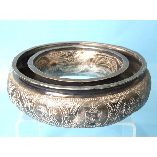 470 - An early-20th century Malaysian white metal posy ring embossed with the Federation Armorial and the ... 