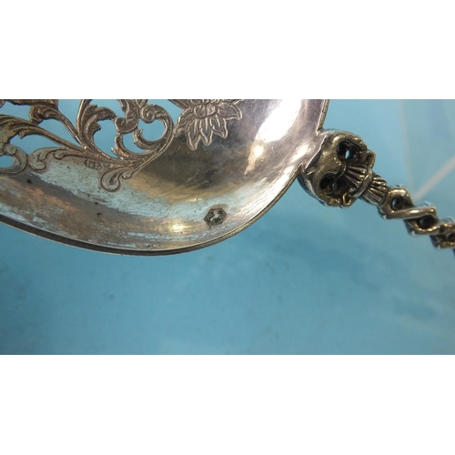 472 - A Dutch silver spoon with windmill finial, (sails lacking) and pierced and engraved bowl, 27cm long,... 