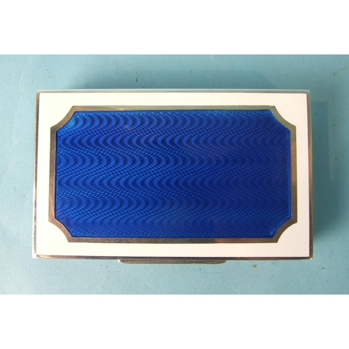 475 - Cartier, an enamelled silver box of rectangular form, the lid with blue guilloche enamel panel, with... 