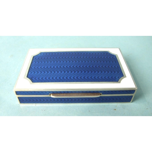 475 - Cartier, an enamelled silver box of rectangular form, the lid with blue guilloche enamel panel, with... 