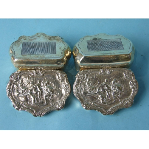 477 - A pair of shaped silver boxes with embossed lids and serrated bases, London 1894, (2).... 