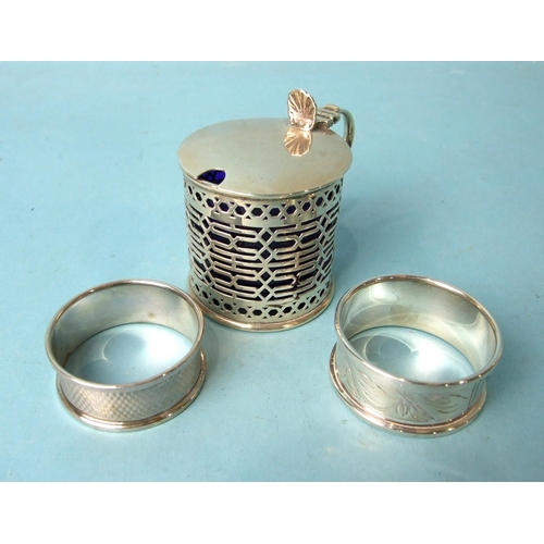 495 - A pierced cylinder mustard with blue glass liner, Chester 1908 and two 20th century napkin rings, (3... 