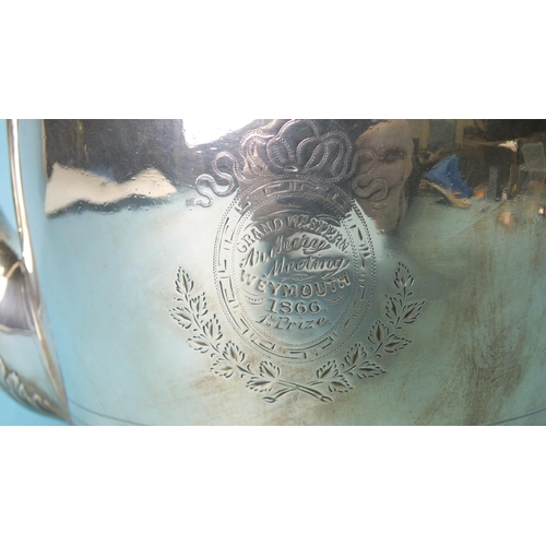 499 - A George III silver teapot of oval outline, with domed hinged lid and chased decoration, with later ... 