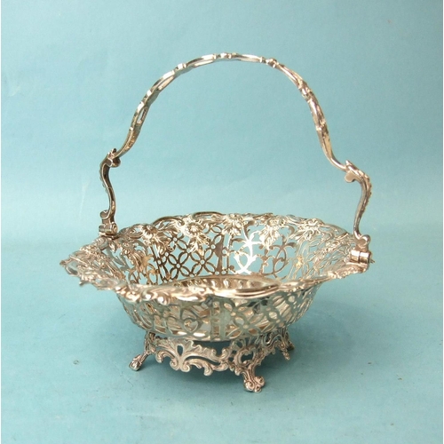 503 - A George III oval pierced sweetmeat basket, the handle and body pierced with flower heads and foliag... 