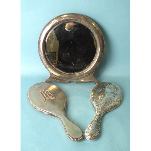 509 - A Victorian silver-backed hand mirror, London 1890, stamped Clark, Old Bond Street, a later beaten-s... 