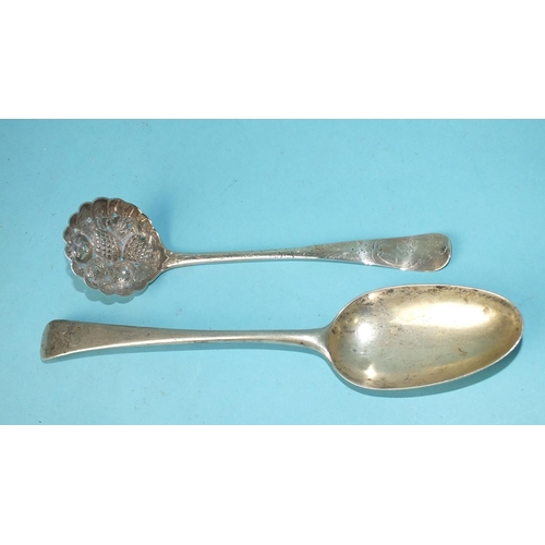 513 - A George III sifter spoon with engraved decoration, the pierced bowl embossed with fruit, London 180... 