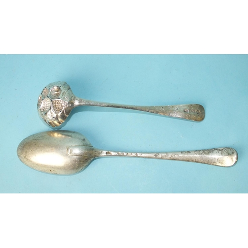 513 - A George III sifter spoon with engraved decoration, the pierced bowl embossed with fruit, London 180... 