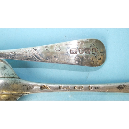 513 - A George III sifter spoon with engraved decoration, the pierced bowl embossed with fruit, London 180... 