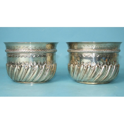 518 - A pair of Victorian circular bowls with half-gadrooned decoration, each inset with a coin, London 18... 