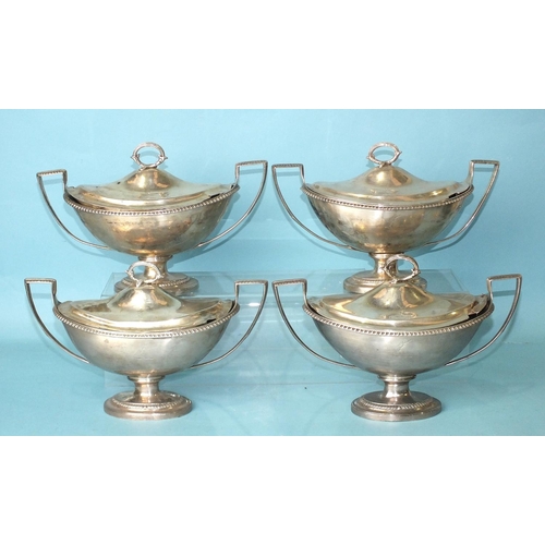 521 - Four Georgian boat-shaped sauce tureens and covers, each with gadrooned rim raised on an oval foot, ... 