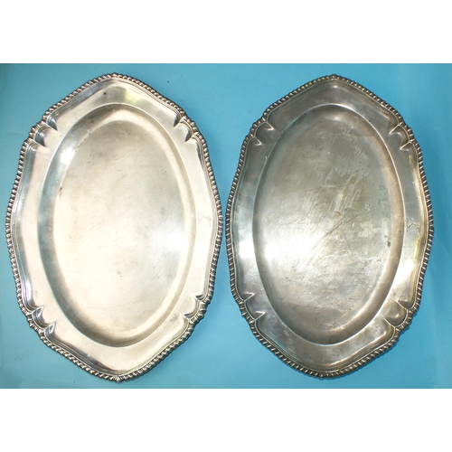 526 - A pair of oval platters with gadrooned borders, 46cm x 33cm, London 1740, ___95oz, (2).  &... 