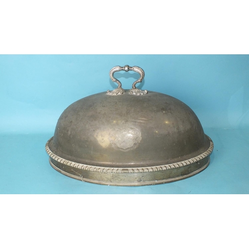 527 - A large oval meat dish cover with foliate handle and gadrooned border, bearing the Bastard family ar... 