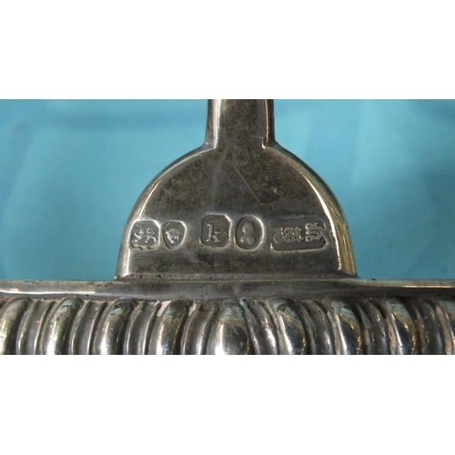 528 - A pair of early-19th century six-division toast racks of arched gadrooned form on shell and tab feet... 