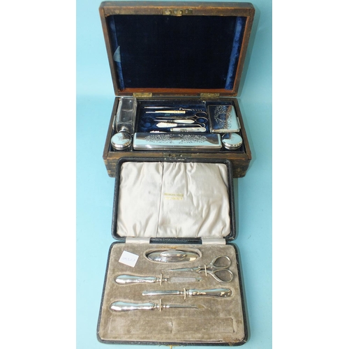 532 - A silver-handled manicure set in fitted box, (scissors replaced by a steel pair), Birmingham 1919 an... 