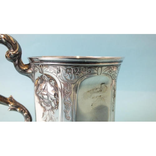 540 - A Victorian hexagonal tankard embossed with flowers and with leaf-capped handle, 11cm high, London 1... 