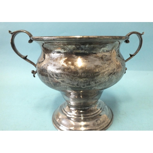 544 - A two-handled trophy cup of bellied form, on circular base, with engraved decoration, 12cm high, Lon... 