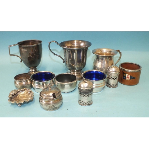 555 - A plain christening tankard with scroll handle, Birmingham 1952, two other christening tankards and ... 