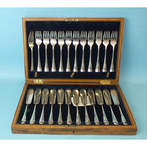 564 - A cased set of silver rat-tail pattern fish knives and forks, (twelve knives, eleven forks), by Jame... 