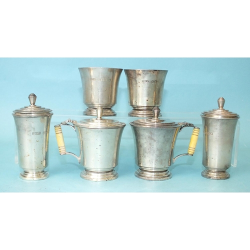 567 - A silver six-piece Art-Deco-style cruet set, each of slightly-flared form on stepped foot, the musta... 