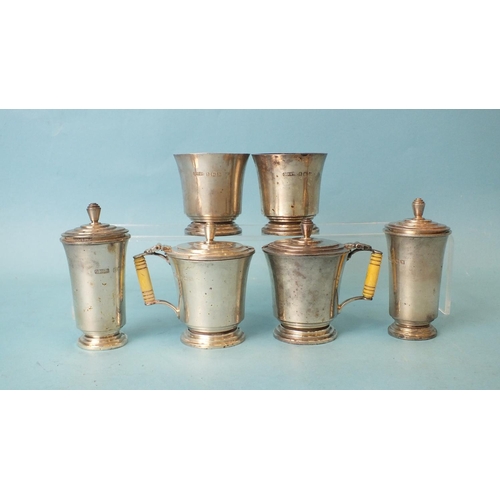 567 - A silver six-piece Art-Deco-style cruet set, each of slightly-flared form on stepped foot, the musta... 