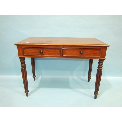 75 - A Victorian mahogany side table, the rectangular top above a pair of frieze drawers, on high turned ... 