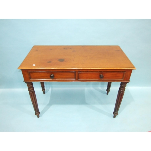 75 - A Victorian mahogany side table, the rectangular top above a pair of frieze drawers, on high turned ... 