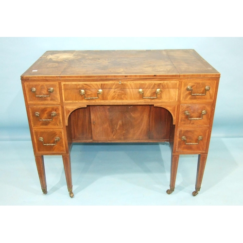 81 - A George III gentleman's mahogany fitted dressing table, the hinged lift top enclosing a folding tri... 