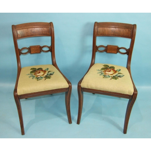 83 - A set of eight George IV mahogany dining chairs, each with pierced and reeded curved back and drop-i... 