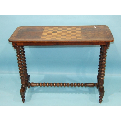 89 - A George IV mahogany fold-over card table, having a concealed frieze drawer on ring-turned legs with... 