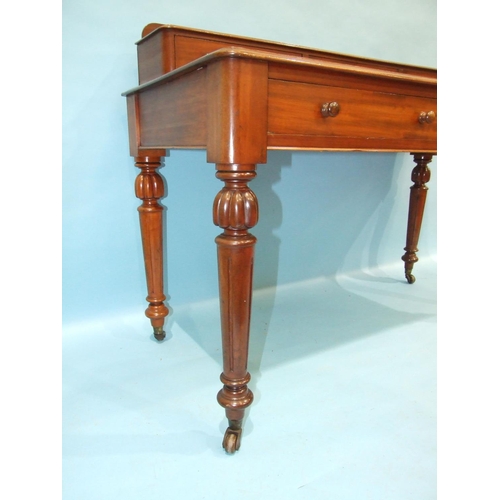 91 - A Victorian mahogany dressing table, the rectangular top surmounted by three small drawers above two... 