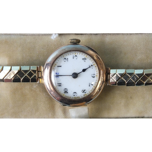 258 - A lady's 9ct-rose-gold-cased wrist watch on plated bracelet, cased, (working).