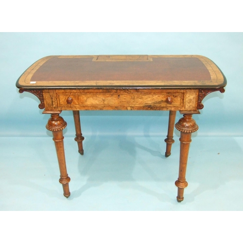 108 - A Victorian burr walnut writing table, the top with rising inkwell flap, (fitment lacking), above a ... 