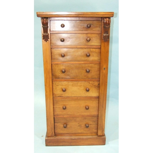 93 - A Victorian Wellington chest of seven graduated drawers, raised on plinth, 49cm wide, 102cm high.... 