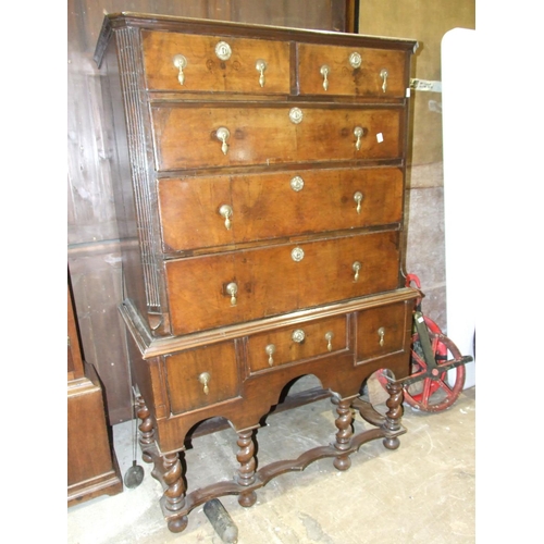 95 - A mainly-18th-century walnut partially-banded chest of two short and three long drawers, within flut... 