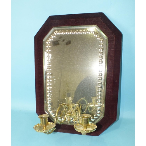 145 - A late-Victorian mirror girandole with twin brass Gothic sconces, 52 x 35cm, (restored).... 