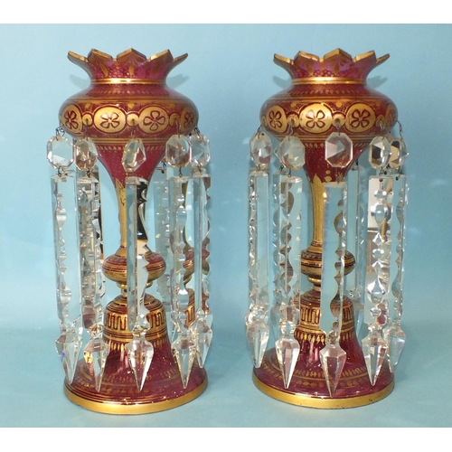 222 - A pair of Victorian gilt and cranberry glass lustres with white cut-glass drops, 33cm high, (one wit... 