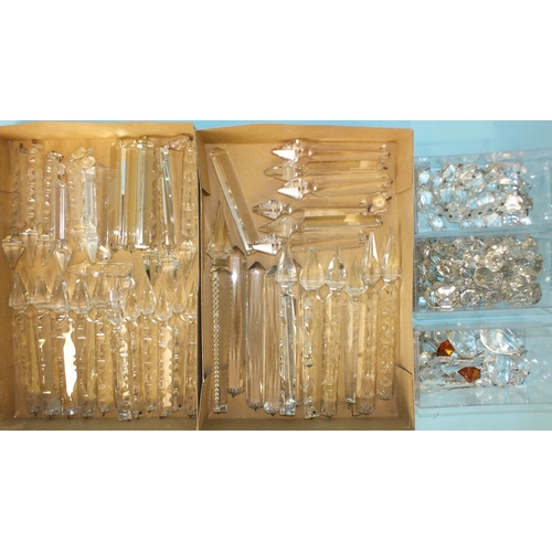 224 - A collection of approximately thirty-eight cut-glass lustre drops and other lustre drop parts.... 