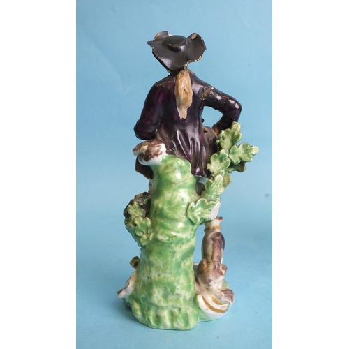 227 - An early-19th century Derby porcelain figure of a seated gentleman playing pipes and a pair of 19th ... 