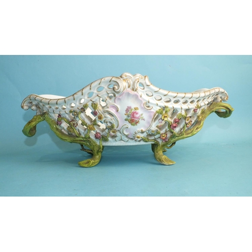 228 - A 19th century Meissen flower-encrusted porcelain pierced basket with branch handles and feet, paint... 