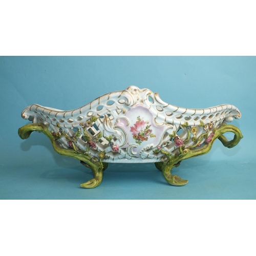 228 - A 19th century Meissen flower-encrusted porcelain pierced basket with branch handles and feet, paint... 