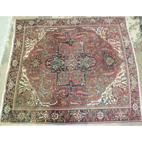 117 - A large Persian carpet, cut and joined across the centre, 340 x 298cm.