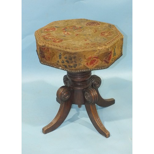 113 - An early-19th century mahogany music stool, the revolving adjustable seat, with original needlework ... 