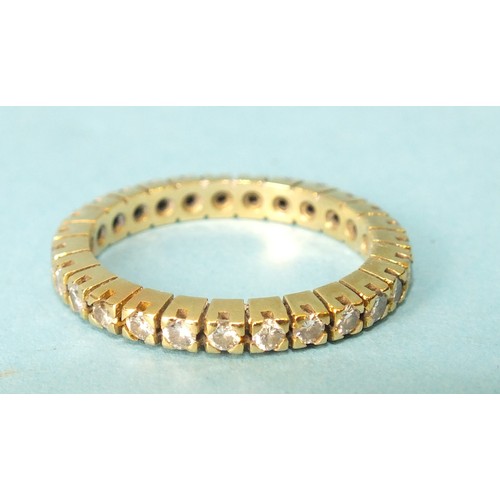 267 - A diamond eternity ring claw-set twenty-seven brilliant-cut diamonds, in unmarked yellow gold mount,... 