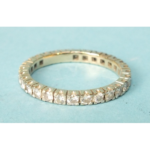 265 - A diamond eternity ring claw-set twenty-eight brilliant-cut diamonds, in unmarked yellow and white g... 