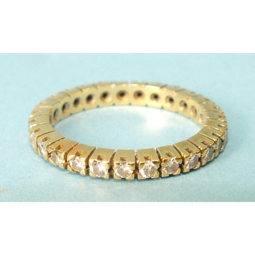 267 - A diamond eternity ring claw-set twenty-seven brilliant-cut diamonds, in unmarked yellow gold mount,... 