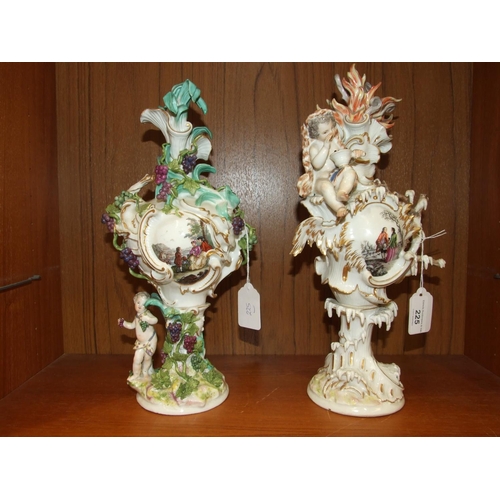 225 - A matched group of four 18th century Meissen vases emblematic of the seasons, 33cm high, crossed swo... 