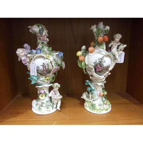 225 - A matched group of four 18th century Meissen vases emblematic of the seasons, 33cm high, crossed swo... 